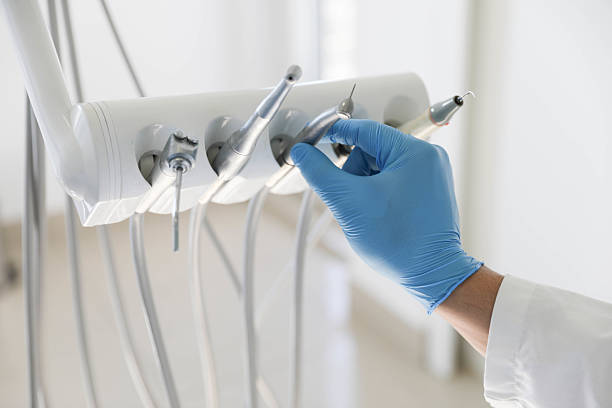 Professional Tooth Extraction technician working in Dover, NH
